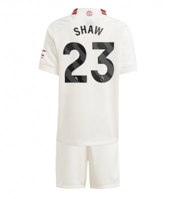 Lacne Dětský Futbalové dres Manchester United Luke Shaw #23 2023-24 Krátky Rukáv - Tretina (+ trenírky)